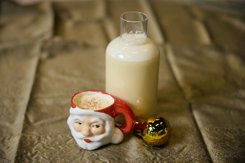 El Segundo, CA - November 26: Matt Belanger, Death & Co.'s L.A. bar manager, making a large batch of eggnog using Death & Co.'s eggnog recipe. Los Angeles Times Kitchen on Tuesday, Nov. 26, 2024 in El Segundo, CA. (Marcus Ubungen / Los Angeles Times)