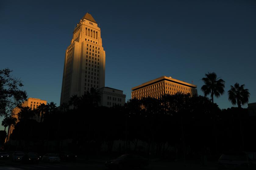 LOS ANGELES, CA - DECEMBER 18, 2024 - - Late afternoon light washes over City Hall in downtown Los Angeles on December 18, 2024. (Genaro Molina/Los Angeles Times)