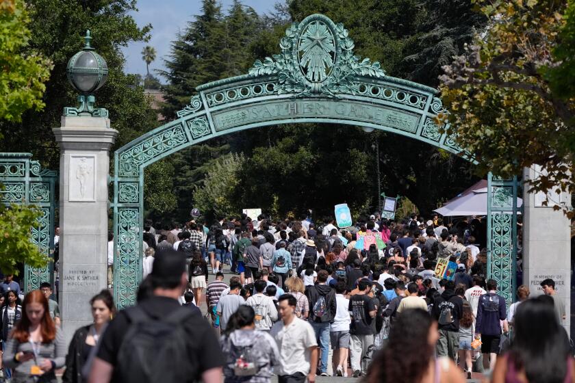 BERKELEY, CALIF. AUGUST 22, 2024 - New students pass through Sather Gate at the University of California, Berkeley on Thursday, Aug. 22, 2024 in Berkeley, Calif. (Paul Kuroda / For The Times)