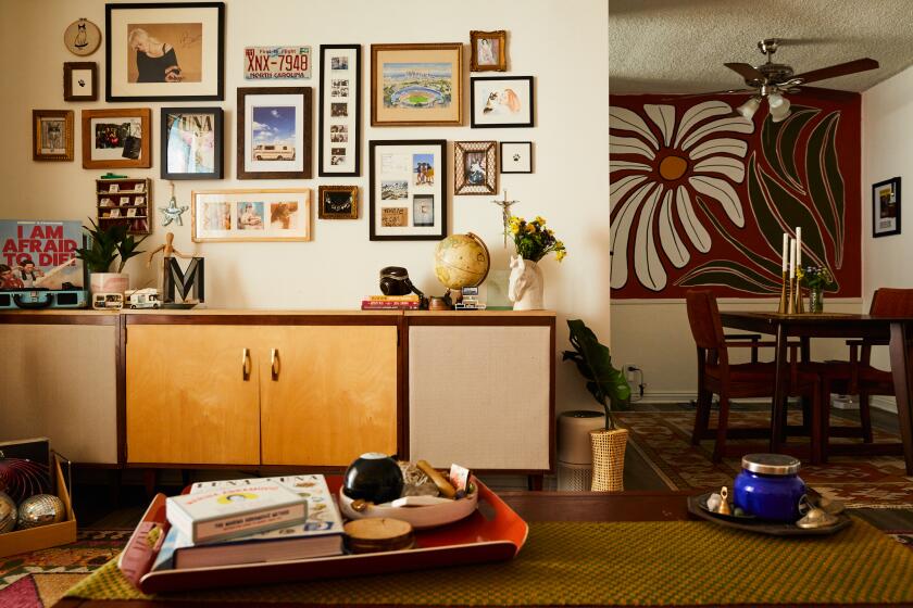 LOS ANGELES, CA - AUGUST 20: Mary Kenny's living room and dining space on Tuesday, August 20, 2024 in Los Angeles, CA. (Brittany Brooks / For The Times)