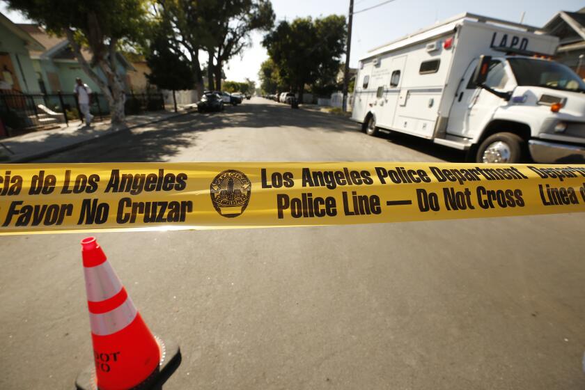 LOS ANGELES, CA - AUGUST 04: East 27th Street between Stanford Avenue and San Pedro Street remains closed with LAPD presence after homes and property suffered damage during the LAPD's fireworks explosion before the 4th of July. Homes and property on the the block of East 27th Street between Stanford Avenue and San Pedro Street were damaged by the LAPD's fireworks detonation that displaced more than 70 people. E. 27th Street and Stanford Avenue on Wednesday, Aug. 4, 2021 in Los Angeles, CA. (Al Seib / Los Angeles Times).