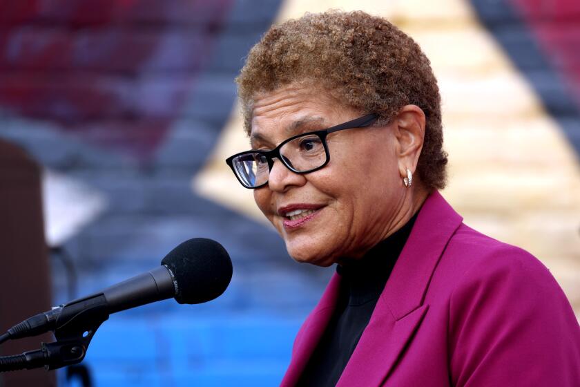 LOS ANGELES, CA - AUGUST 29, 2024 - Los Angeles Mayor Karen Bass speaks at the unveiling and dedication ceremony of the Gloria Molina mural at Casa 0101 Theater in the Boyle Heights on August 29, 2024. Los Angeles City Council members Kevin de Leon and Monica Rodriguez, Rep. Maxine Waters and former California Senate and L.A. City Council member Gil Cedillo attended the event. Artist Margaret Garcia was commissioned to create the mural as the Los Angeles City Council proclaimed Aug. 29 as, "Gloria Molina Day." (Genaro Molina/Los Angeles Times)