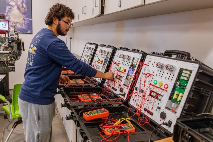 Bakersfield, CA - November 09: David Ibanez, 17, works in the robotics lab at Kern High School District's Career & Technical Education Center on Thursday, Nov. 9, 2023 in Bakersfield, CA. (Brian van der Brug / Los Angeles Times)