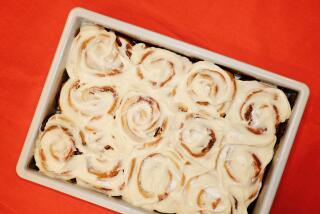 Milk Bar founder and pastry chef Christina Tosi bakes cinnamon buns with brown sugar "goo" in the L.A. Times Test Kitchen.