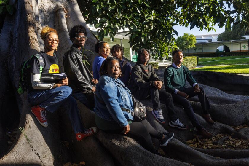 LOS ANGELES, CA - SEPTEMBER 26, 2024: Dorsey High schools students and faculty who are a part of the Black Students Achievement Plan program or BASP on September 26, 2024 in Los Angeles, California. Back row, from the left, student Braxton Jordan, student Maki Draper, teacher Ebony Batiste, student Caleel Smith; front row, left to right, Georgia Flowers Lee, co-chair of the BSAP Steering Committee, student Kei'Shawn Henderson and teacher Bryant Odega.(Gina Ferazzi / Los Angeles Times)