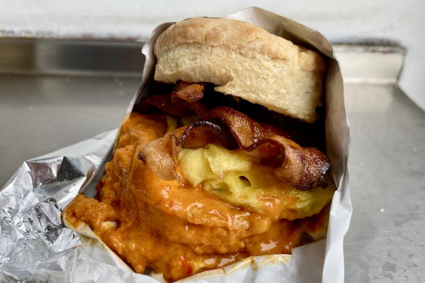 The biscuit breakfast sandwich at Calabama with bacon and pimento cheese.