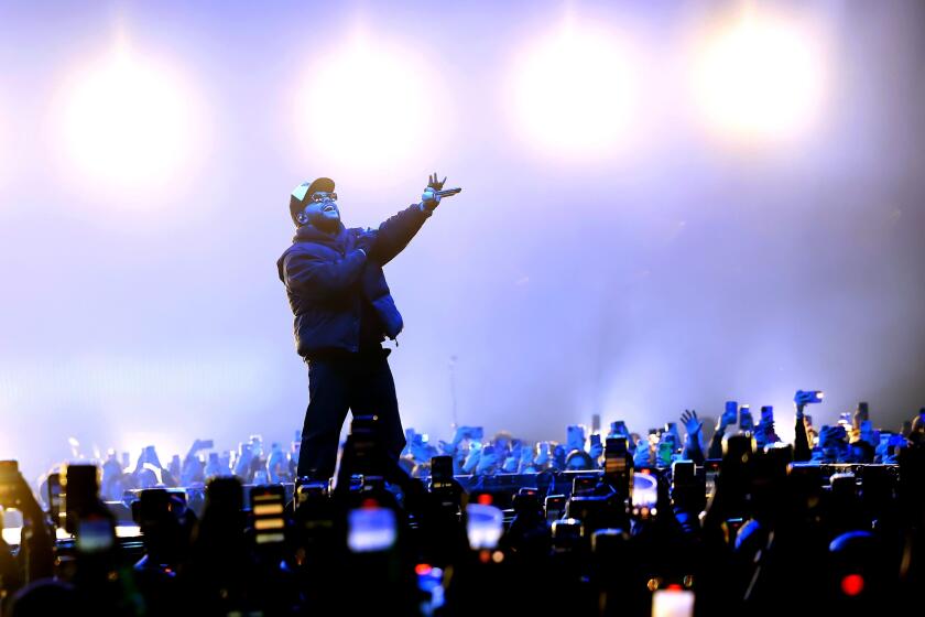 The Weeknd performs at the Barker Hangar in Santa Monica, Calif., on Tuesday.